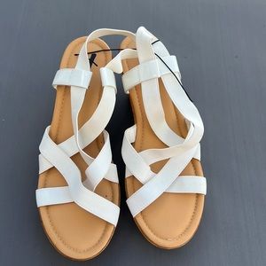 One pair white size 11W sandals